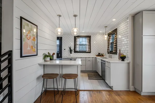 a kitchen with a sink cabinets and window