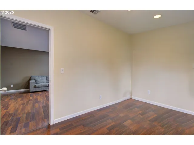 a view of wooden floor and cabinet