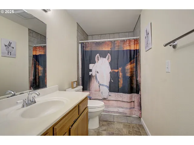 a bathroom with a sink vanity and a mirror