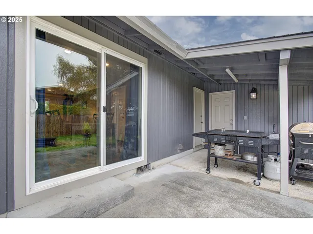 a living room with furniture a window and a table