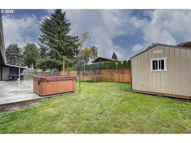 a swimming pool with yard in front of it