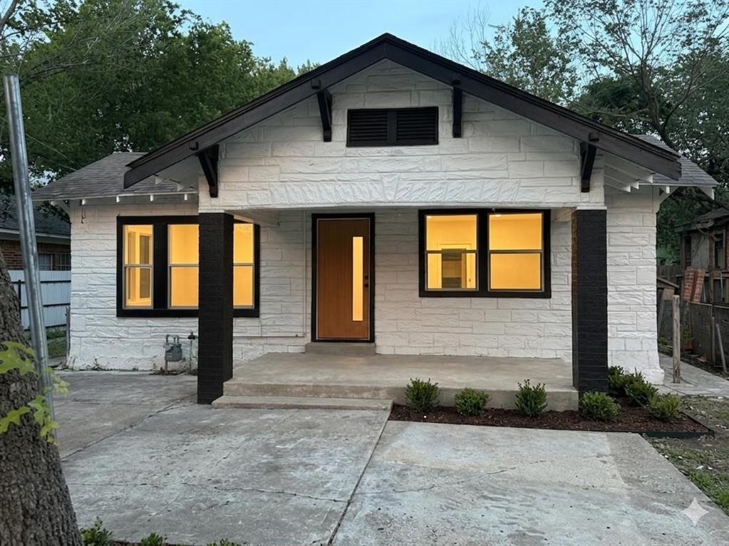 758 Bethpage Avenue Dallas, TX 75217 - Photo 1 of 20 a front view of a house with garden