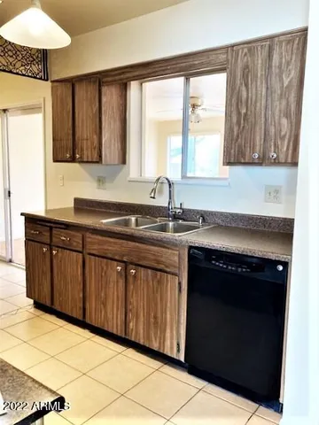 a kitchen with stainless steel appliances a sink stove and cabinets