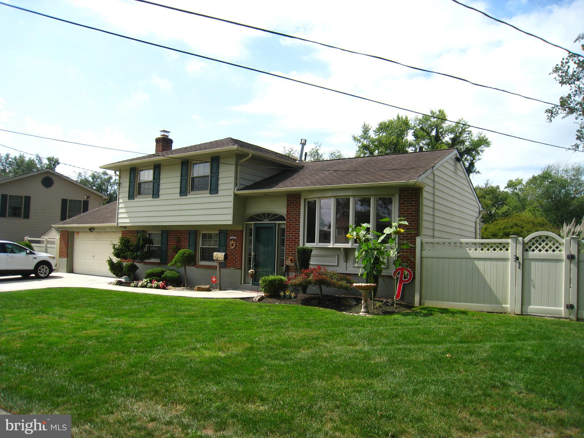 a front view of house with yard and outdoor seating