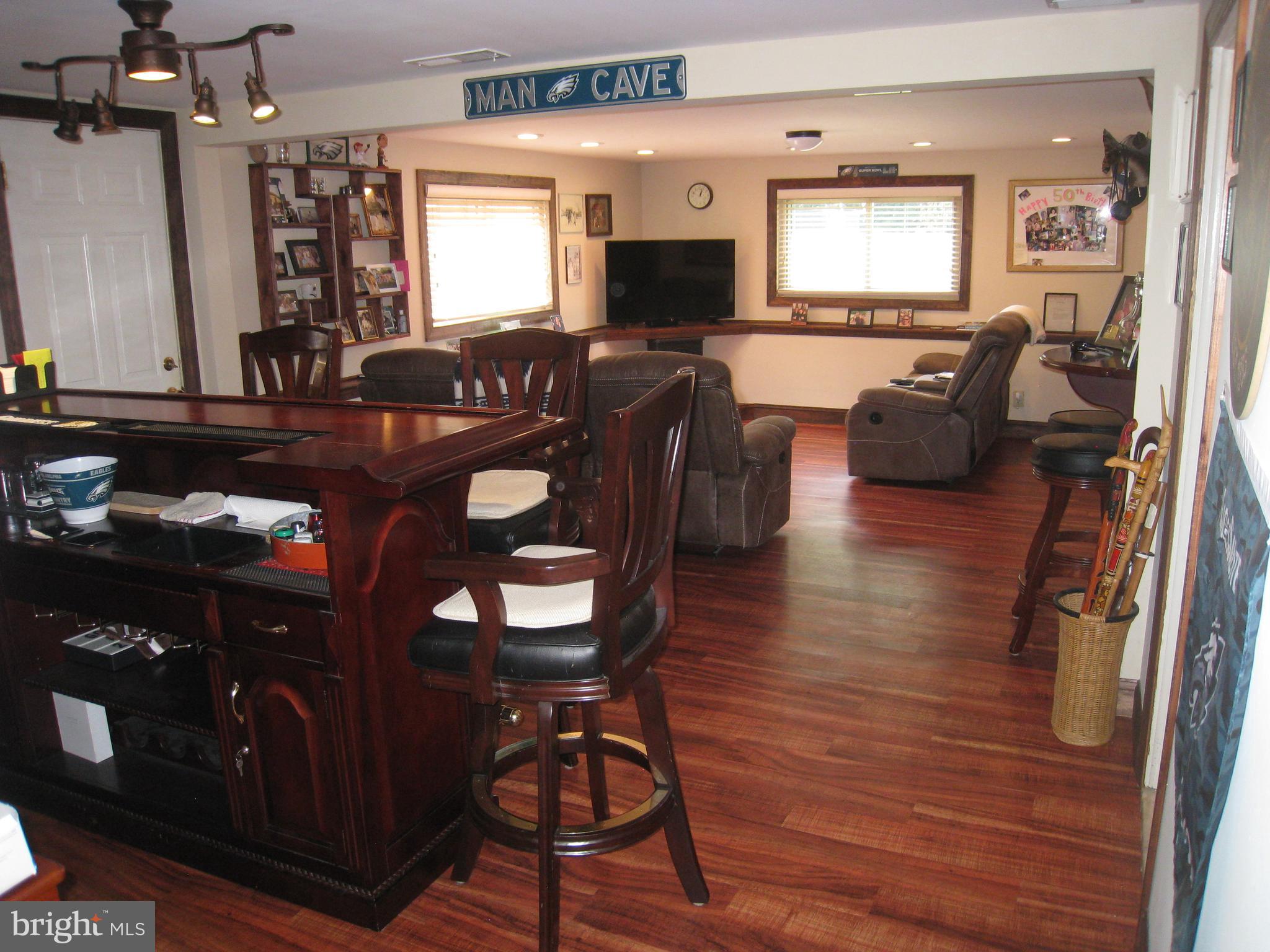 29 Buttonwood Road Stratford, NJ 08084 - Photo 16 of 45 a living room with furniture and a flat screen tv