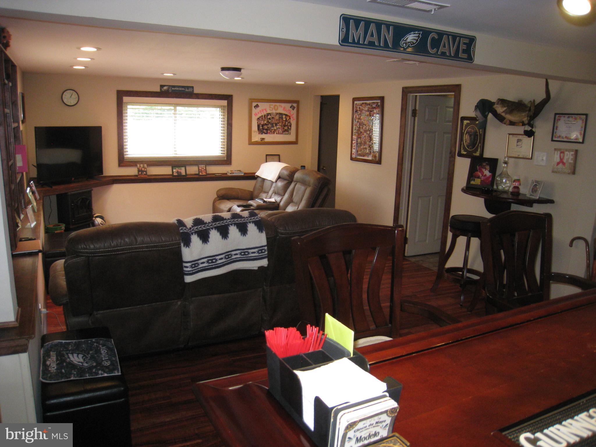 29 Buttonwood Road Stratford, NJ 08084 - Photo 17 of 45 a living room with furniture fireplace and flat screen tv