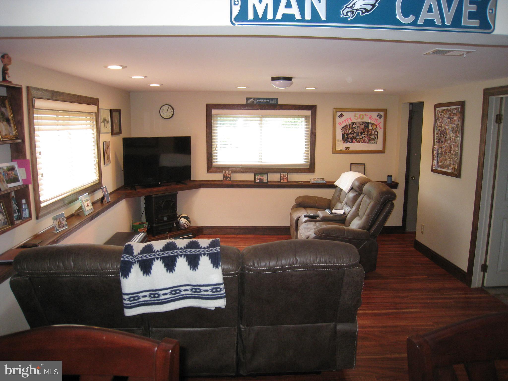 29 Buttonwood Road Stratford, NJ 08084 - Photo 18 of 45 a living room with furniture and a flat screen tv