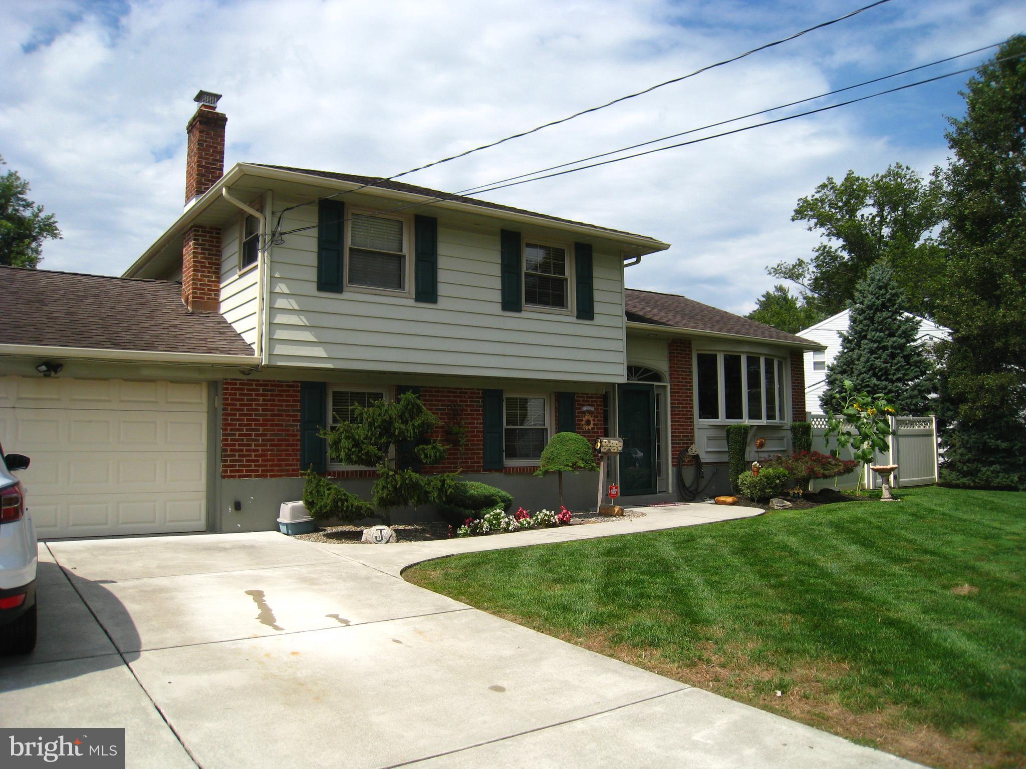 29 Buttonwood Road Stratford, NJ 08084 - Photo 3 of 45 a front view of a house with a yard