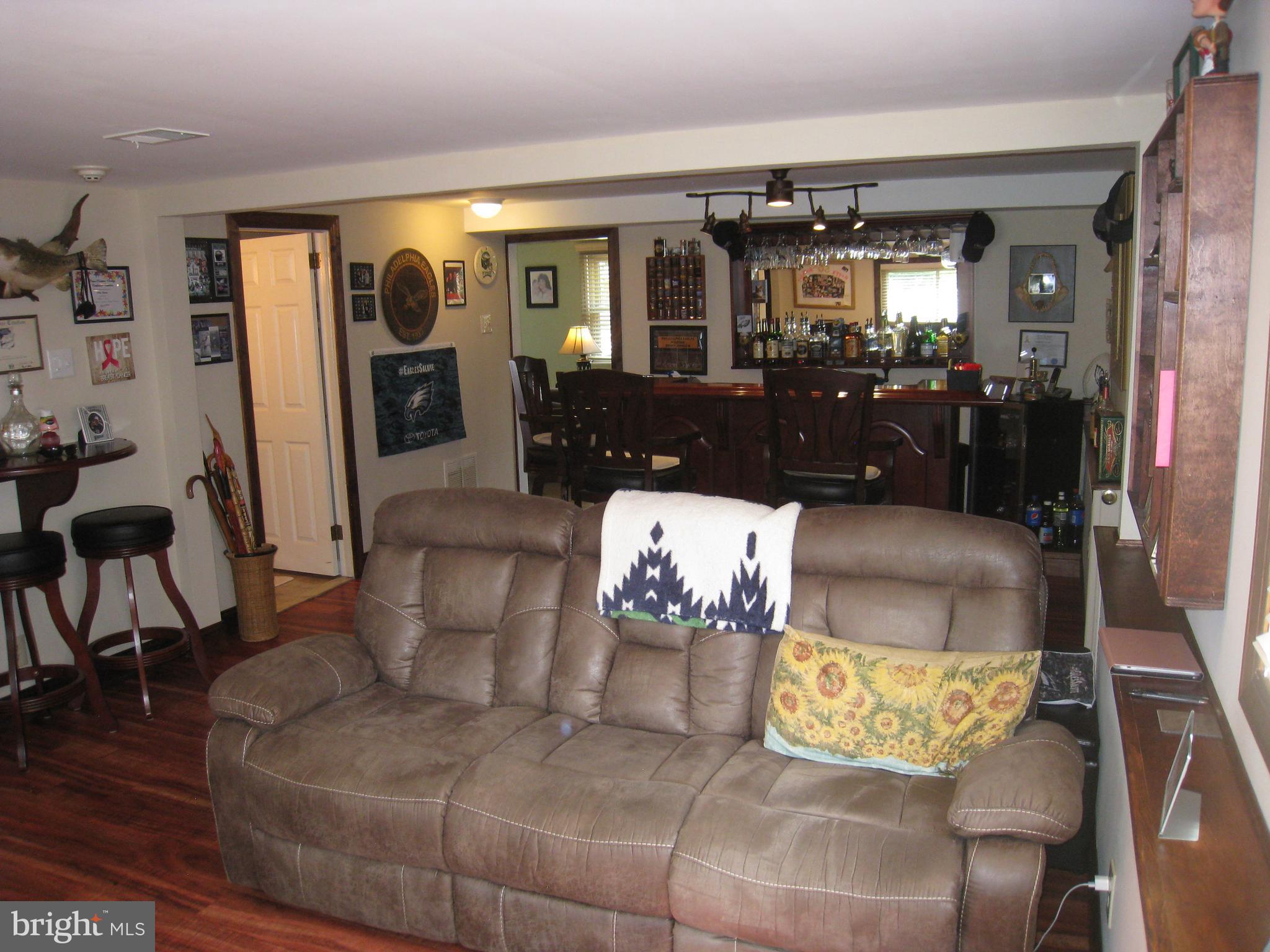 29 Buttonwood Road Stratford, NJ 08084 - Photo 21 of 45 a living room with furniture and wooden floor