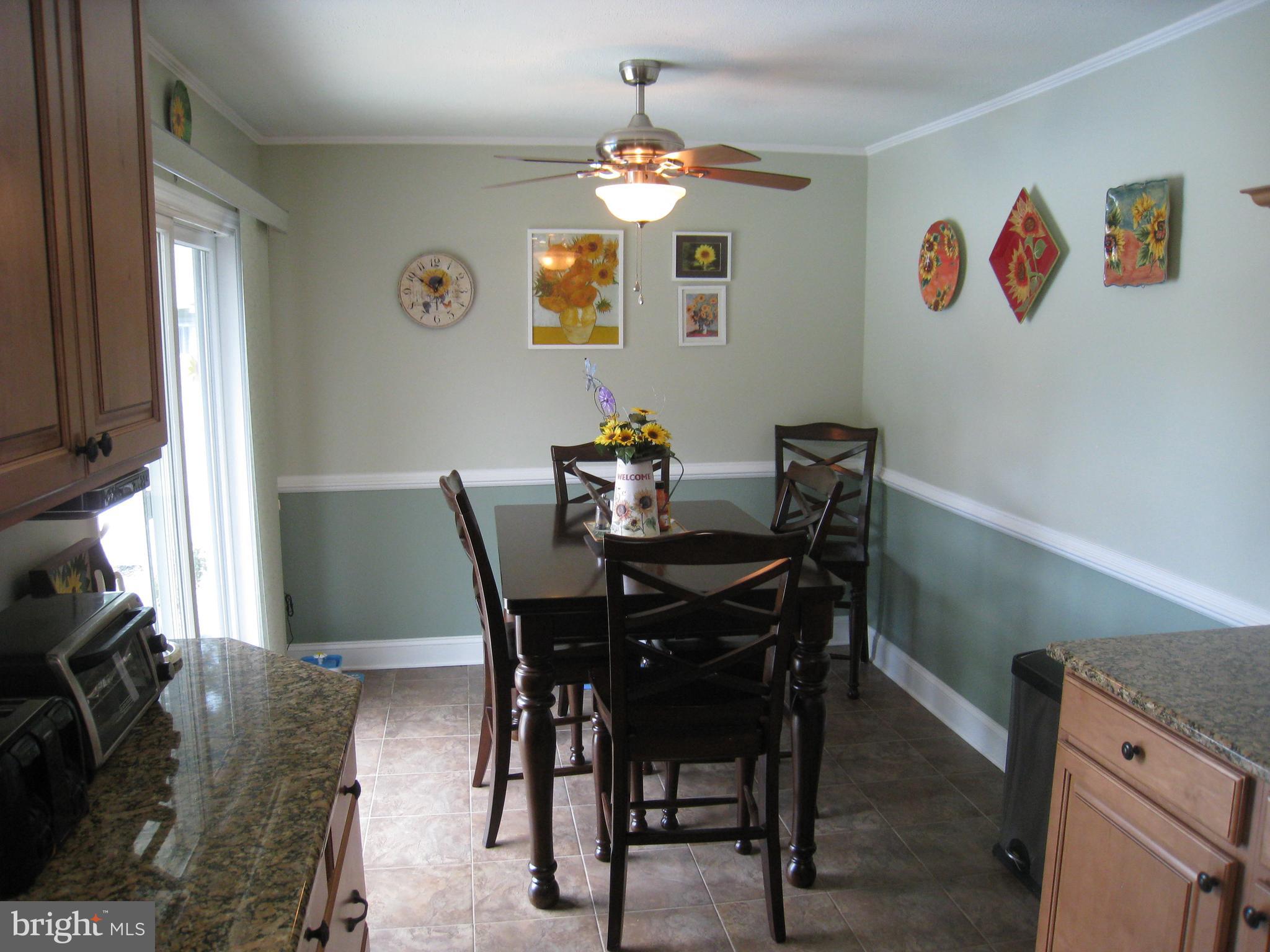 29 Buttonwood Road Stratford, NJ 08084 - Photo 26 of 45 a view of a dining room with furniture and chandelier