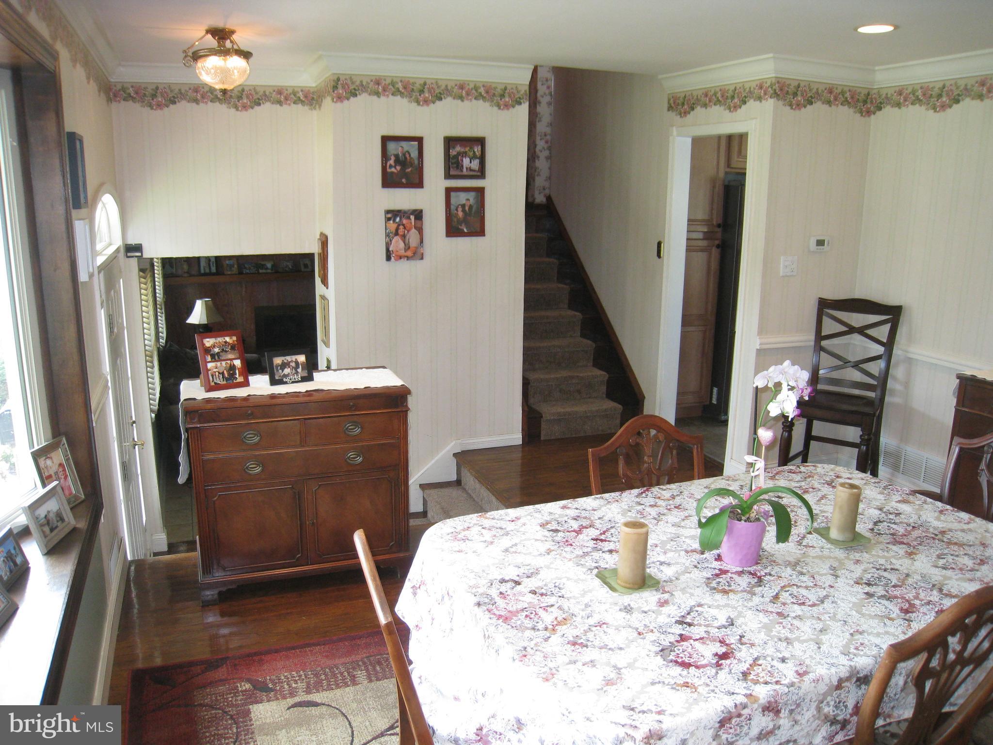 29 Buttonwood Road Stratford, NJ 08084 - Photo 30 of 45 a view of a dining room with furniture a chandelier and wooden floor