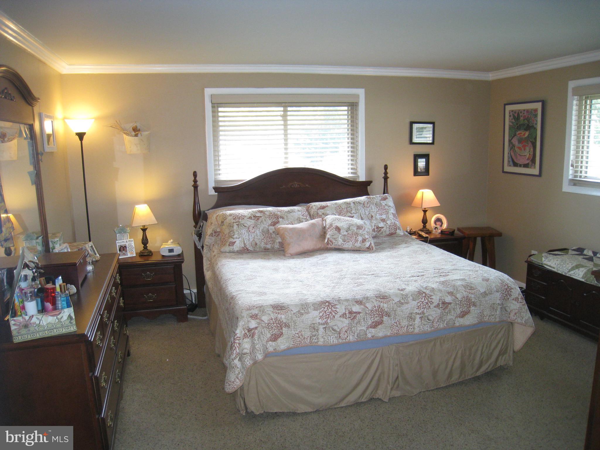 29 Buttonwood Road Stratford, NJ 08084 - Photo 32 of 45 a bedroom with a bed and a lamp
