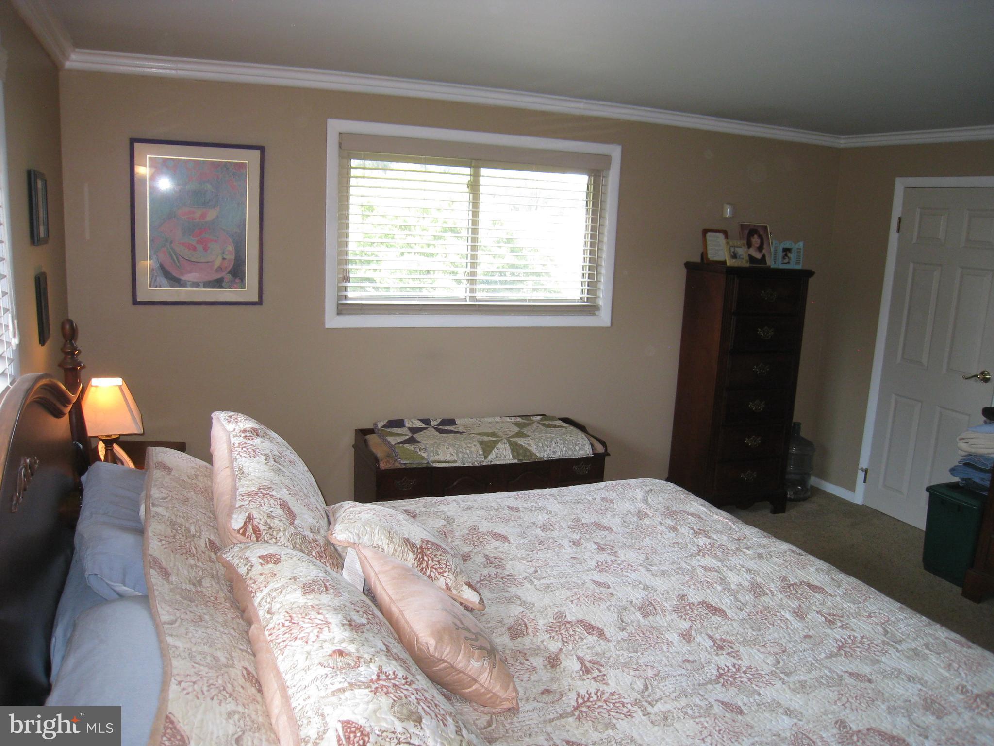 29 Buttonwood Road Stratford, NJ 08084 - Photo 33 of 45 a bedroom with a bed and wooden floor