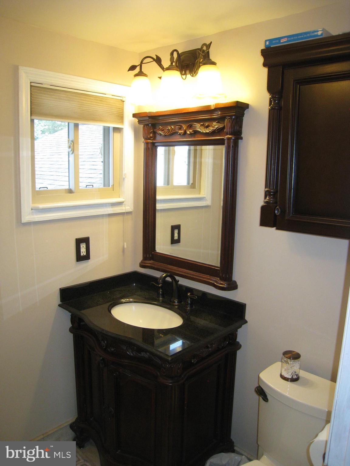29 Buttonwood Road Stratford, NJ 08084 - Photo 35 of 45 a bathroom with a sink and a toilet