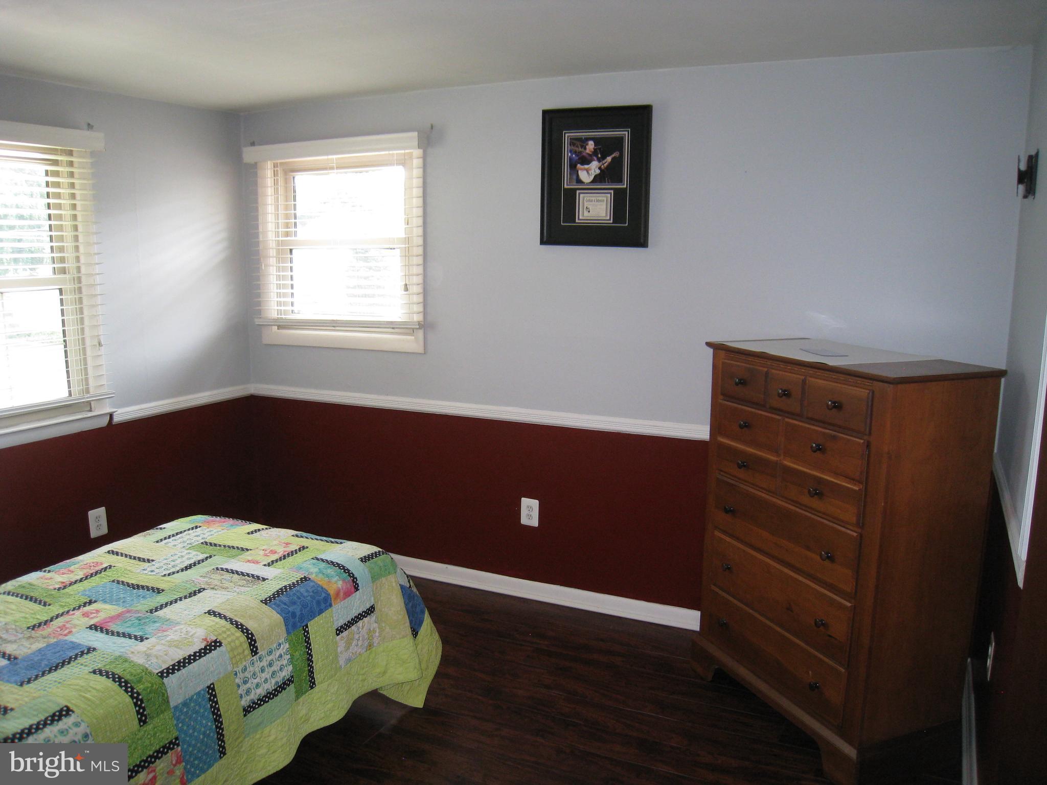29 Buttonwood Road Stratford, NJ 08084 - Photo 37 of 45 a bedroom with a bed and a window