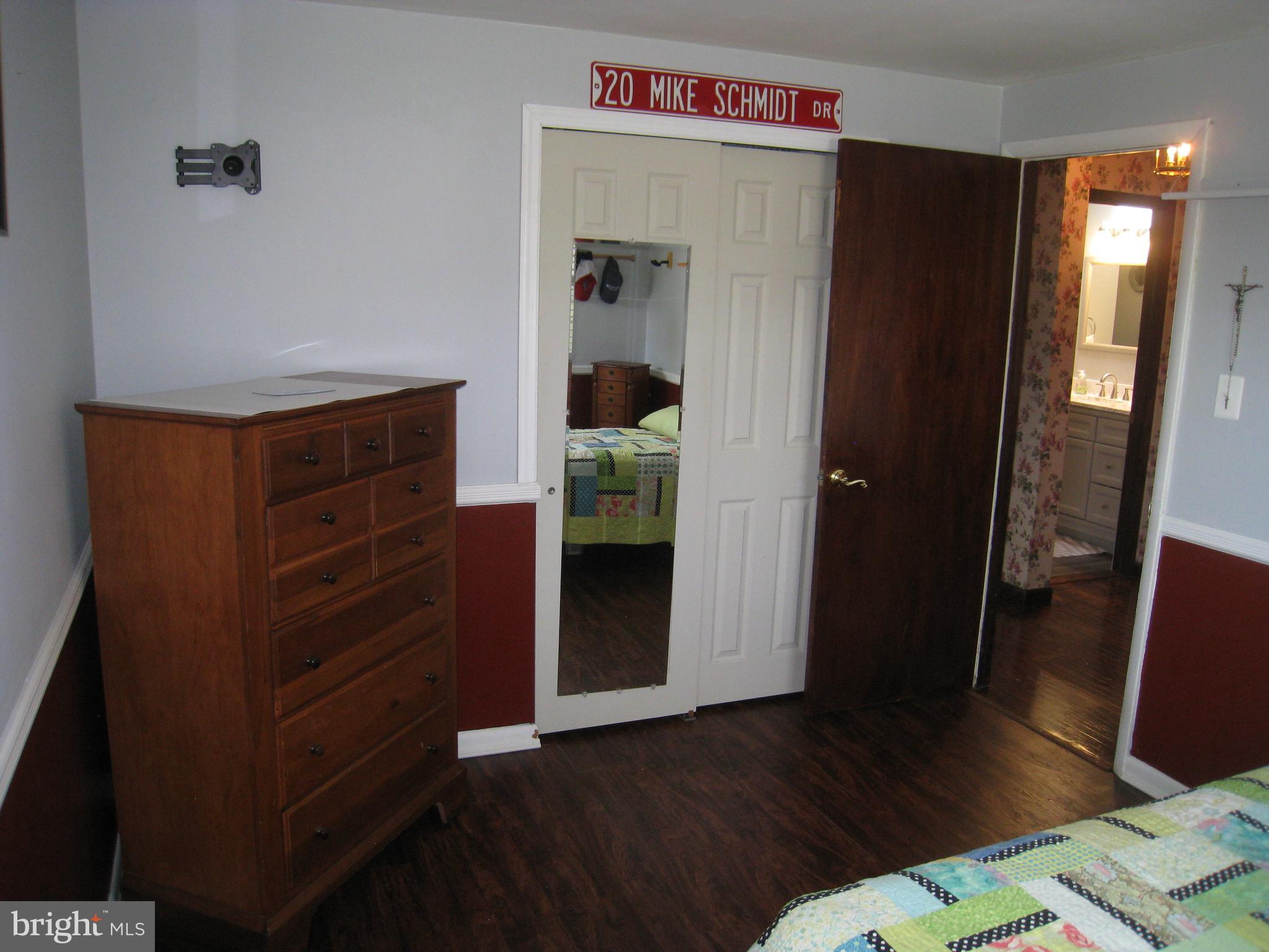 29 Buttonwood Road Stratford, NJ 08084 - Photo 39 of 45 a room with a bed and wooden floor