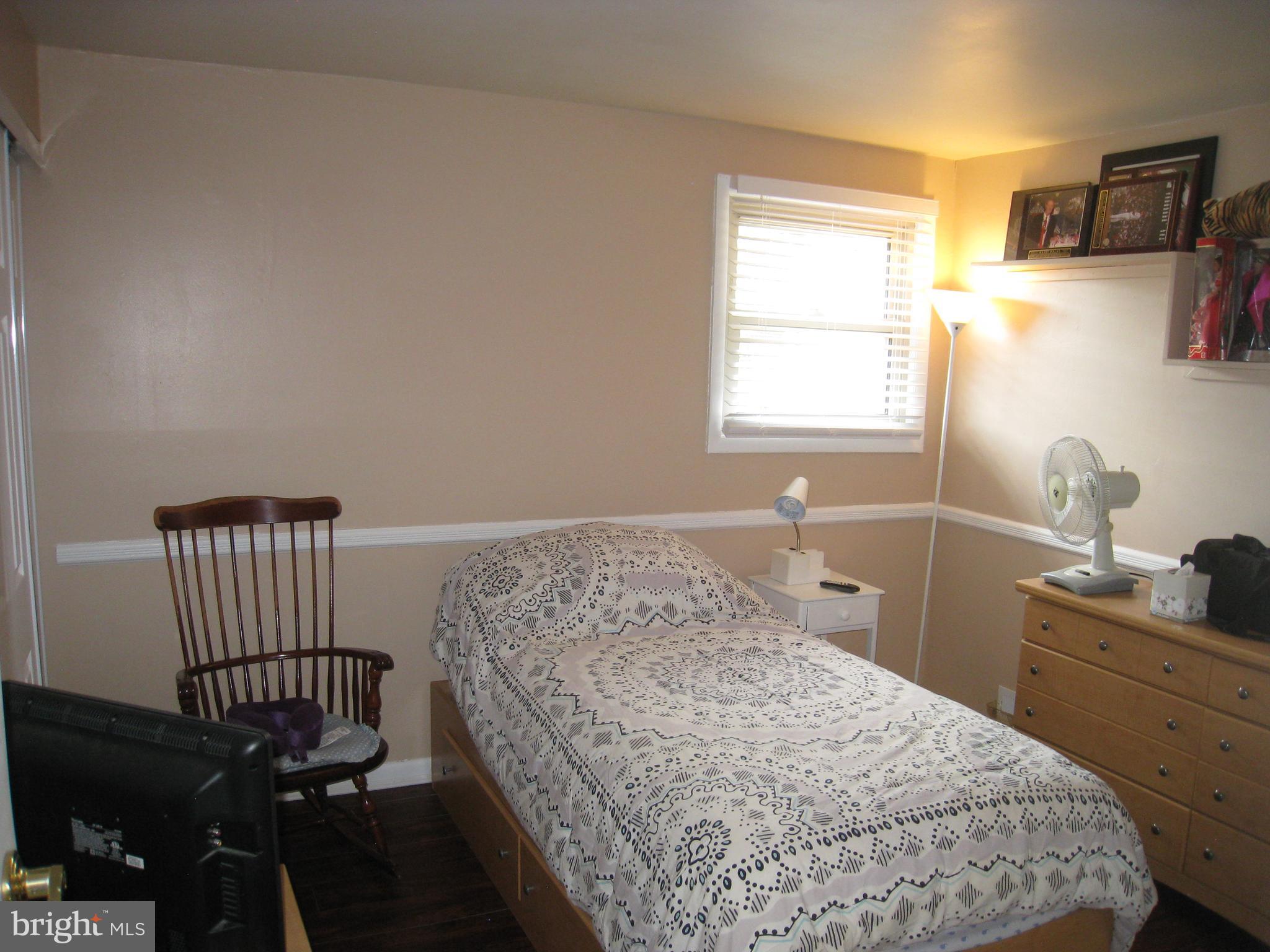 29 Buttonwood Road Stratford, NJ 08084 - Photo 43 of 45 a bedroom with a bed and a window