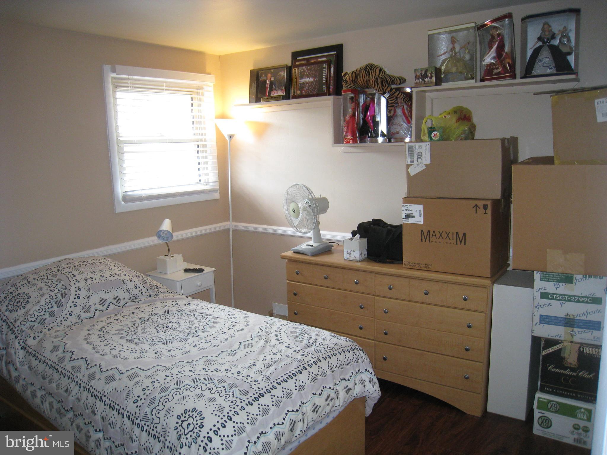 29 Buttonwood Road Stratford, NJ 08084 - Photo 44 of 45 a bedroom with a bed and a window