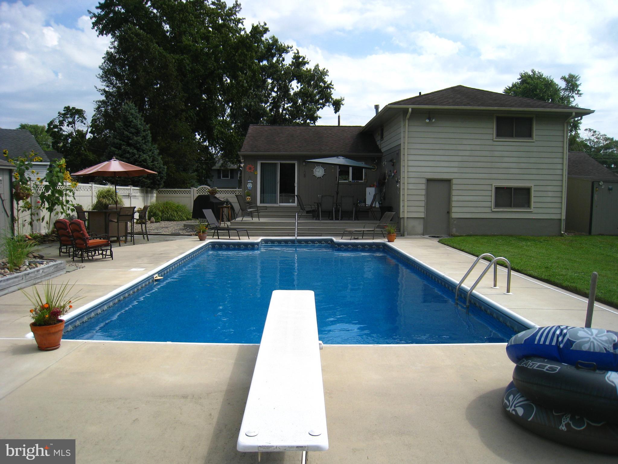 29 Buttonwood Road Stratford, NJ 08084 - Photo 8 of 45 a view of backyard with swimming pool and furniture