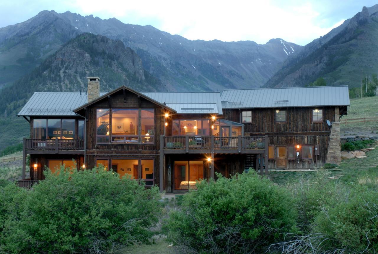 3315 Last Dollar Road Telluride, CO 81435 - Photo 1 of 12 a backyard of a house with wooden floor and a yard