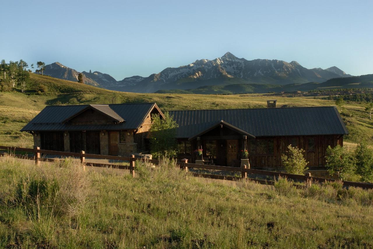 3315 Last Dollar Road Telluride, CO 81435 - Photo 12 of 12 a view of a table and chairs under an umbrella