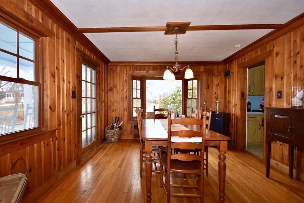 460 Williston Road Bourne, MA 02562 - Photo 13 of 37 a view of a dining room with furniture window and wooden floor