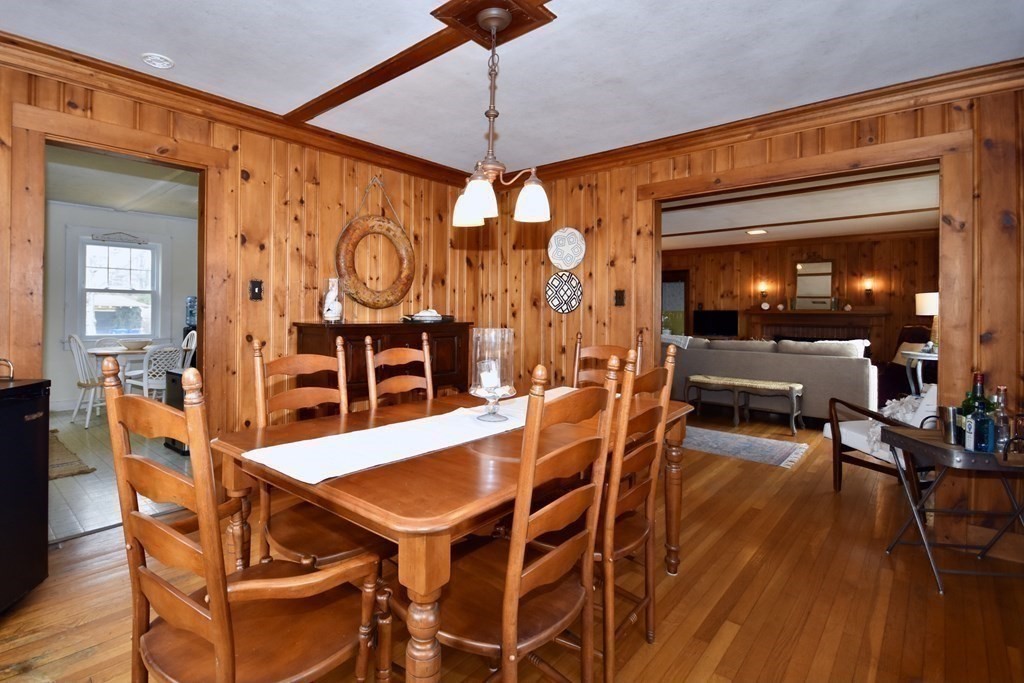 460 Williston Road Bourne, MA 02562 - Photo 14 of 37 a view of a dining room with furniture and wooden floor