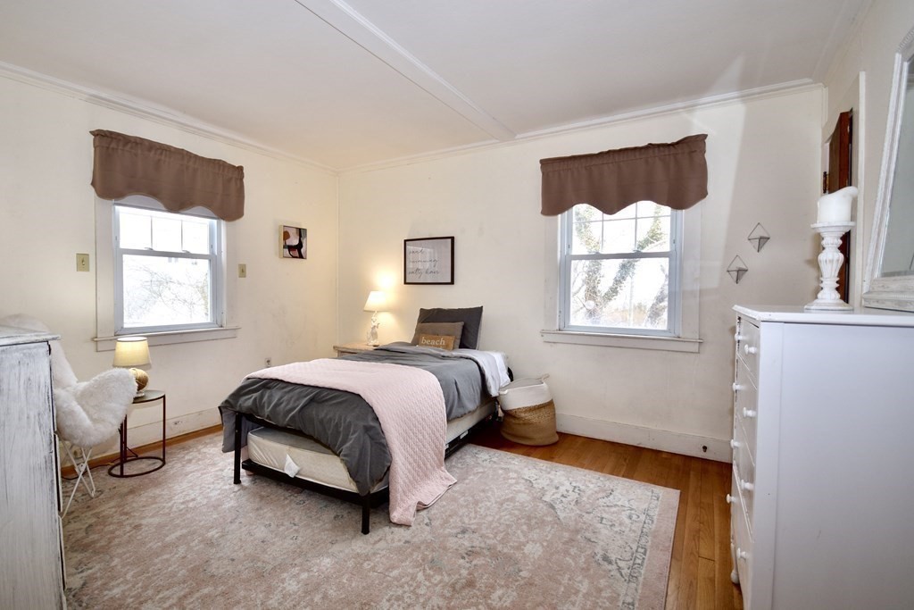 460 Williston Road Bourne, MA 02562 - Photo 18 of 37 a spacious bedroom with a bed and a window