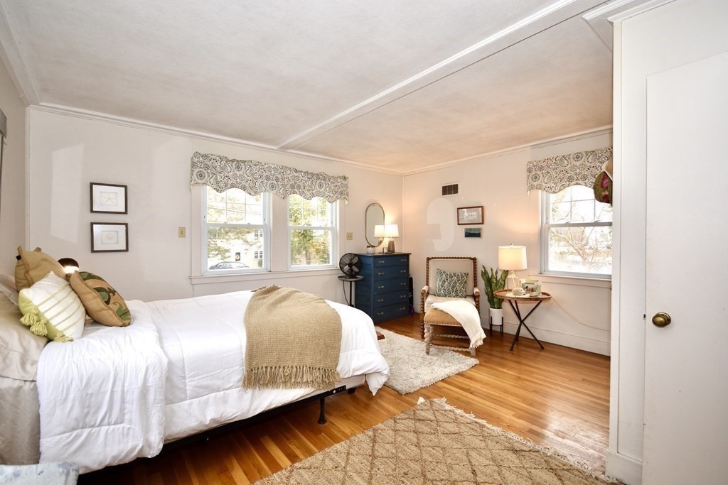 460 Williston Road Bourne, MA 02562 - Photo 22 of 37 a bedroom with a bed and wooden floor