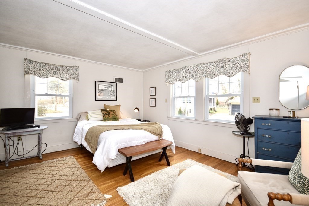 460 Williston Road Bourne, MA 02562 - Photo 24 of 37 a bed room with a bed window and a chair
