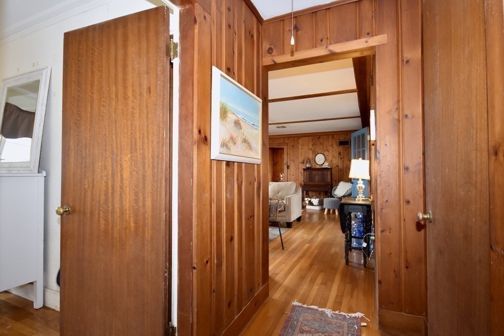 460 Williston Road Bourne, MA 02562 - Photo 25 of 37 a view of a room that has a bed and a mirror