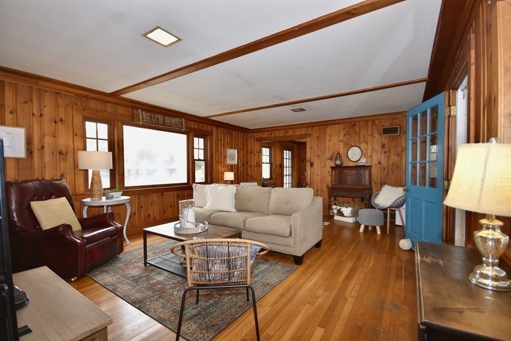 460 Williston Road Bourne, MA 02562 - Photo 8 of 37 a living room with furniture and a large window