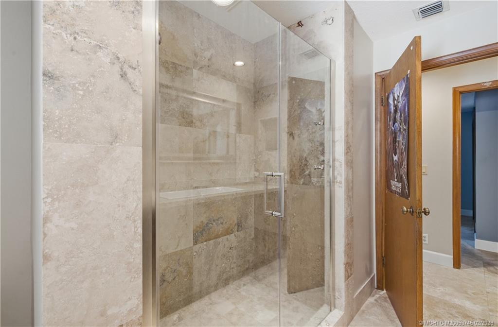 5186 Southeast Harrold Terrace Stuart, FL 34997 - Photo 25 of 50 a bathroom with a shower