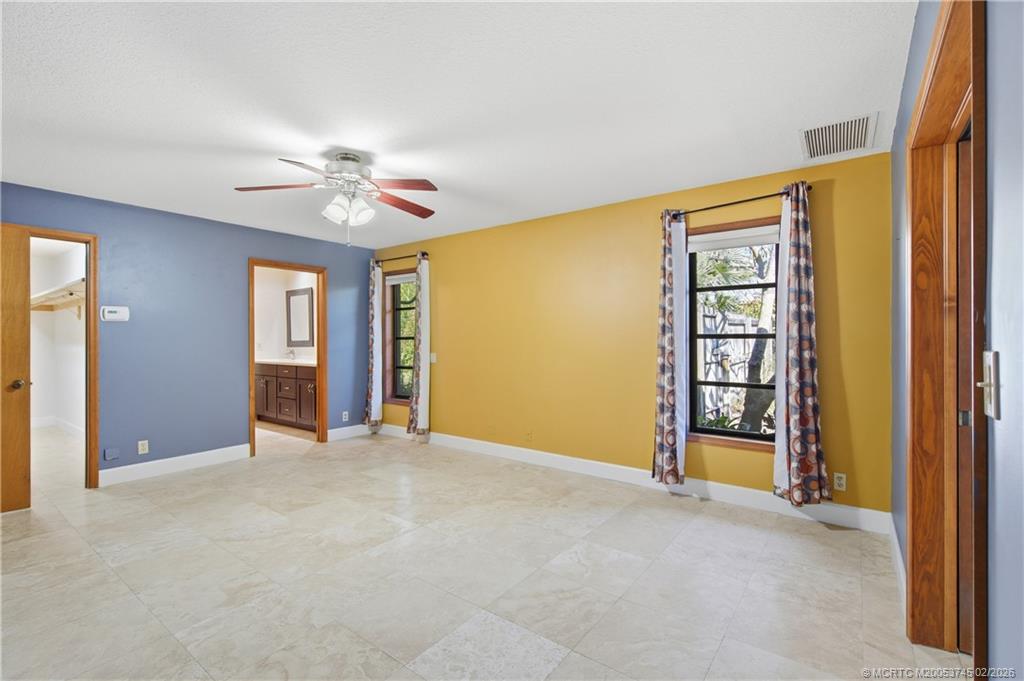 5186 Southeast Harrold Terrace Stuart, FL 34997 - Photo 31 of 50 a view of an empty room with a window