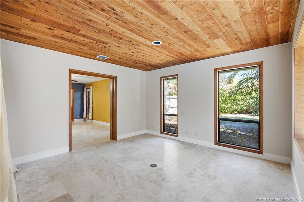 5186 Southeast Harrold Terrace Stuart, FL 34997 - Photo 33 of 50 a view of an empty room with a window