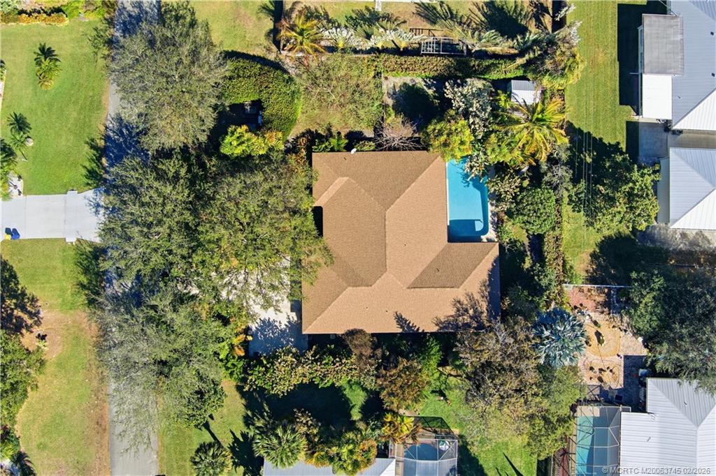 5186 Southeast Harrold Terrace Stuart, FL 34997 - Photo 45 of 50 an aerial view of a house with yard and outdoor seating