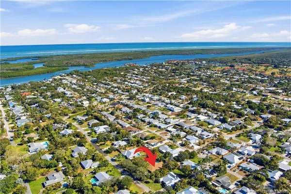 a view of a large body of water with a building in the background