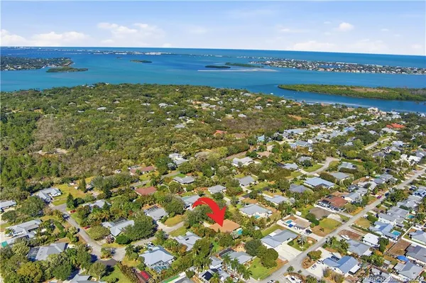 a view of a field with an ocean