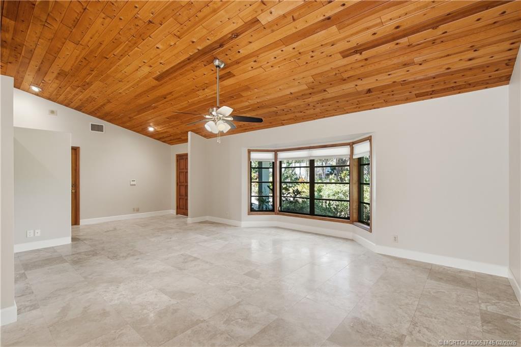 5186 Southeast Harrold Terrace Stuart, FL 34997 - Photo 10 of 50 a view of an empty room with a window