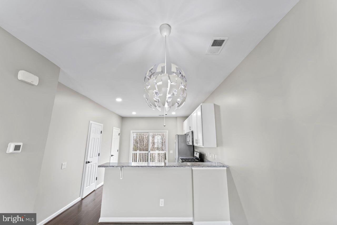 17045 Gibson Road Dumfries, VA 22026 - Photo 13 of 32 Modern kitchen with stylish lighting.