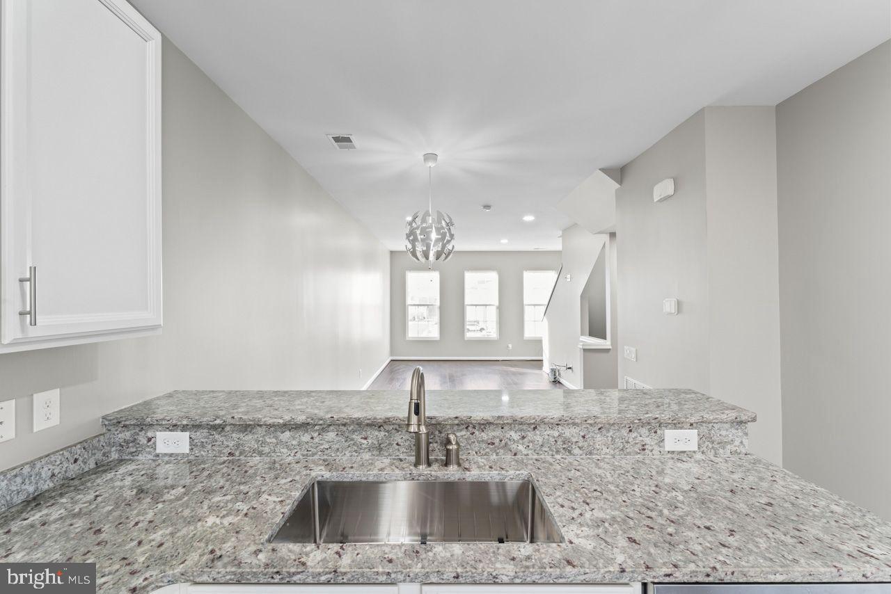 17045 Gibson Road Dumfries, VA 22026 - Photo 17 of 32 Modern kitchen with sleek finishes.