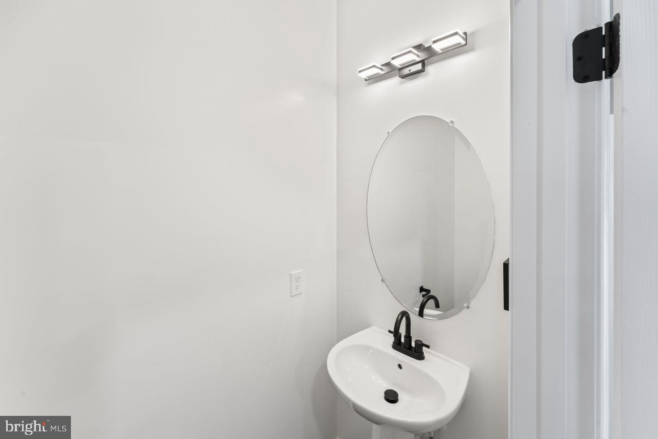 17045 Gibson Road Dumfries, VA 22026 - Photo 19 of 32 Sleek and modern half-bath oasis.