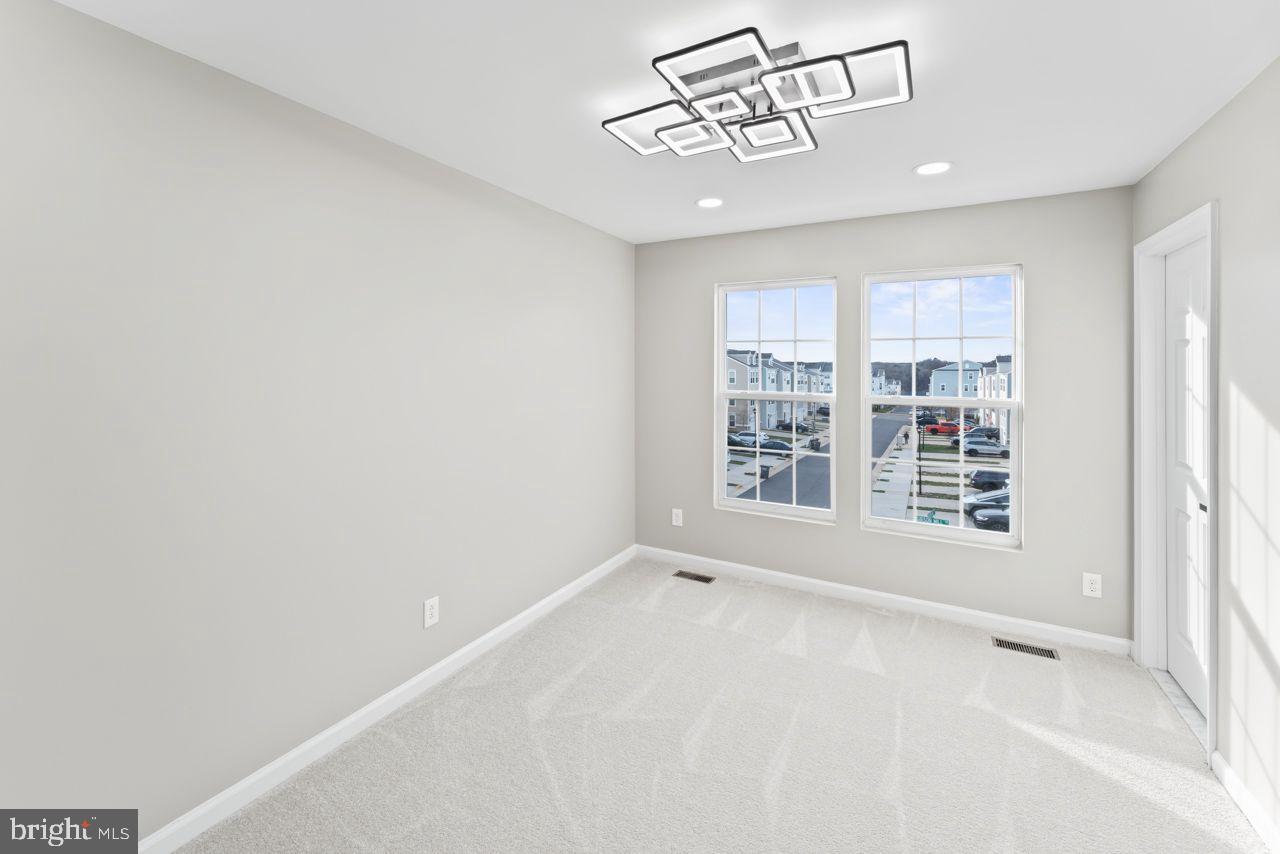 17045 Gibson Road Dumfries, VA 22026 - Photo 23 of 32 Bright and airy room with modern lighting.