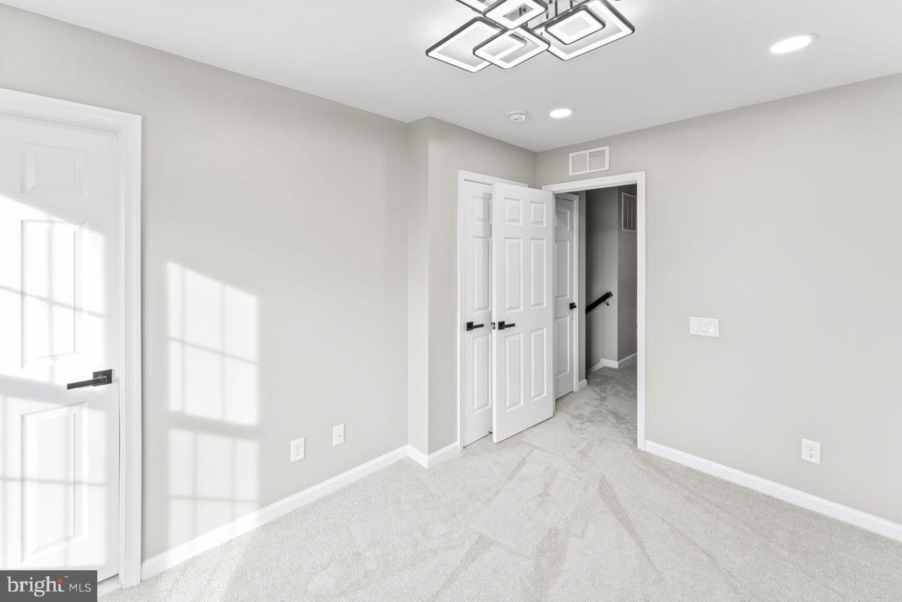 17045 Gibson Road Dumfries, VA 22026 - Photo 24 of 32 Bright and airy modern room with dual doors.