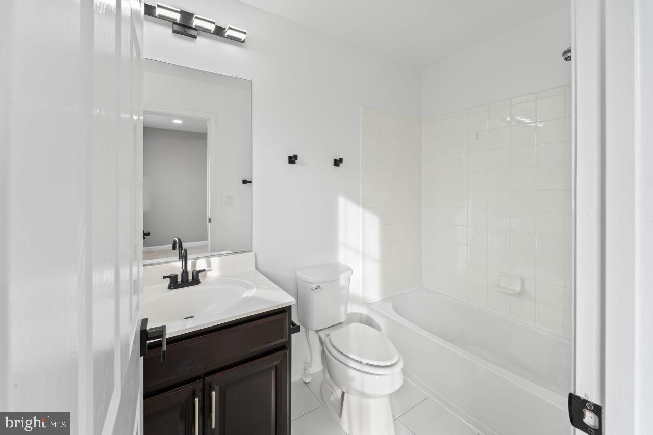 17045 Gibson Road Dumfries, VA 22026 - Photo 25 of 32 Modern bathroom with sleek finishes.