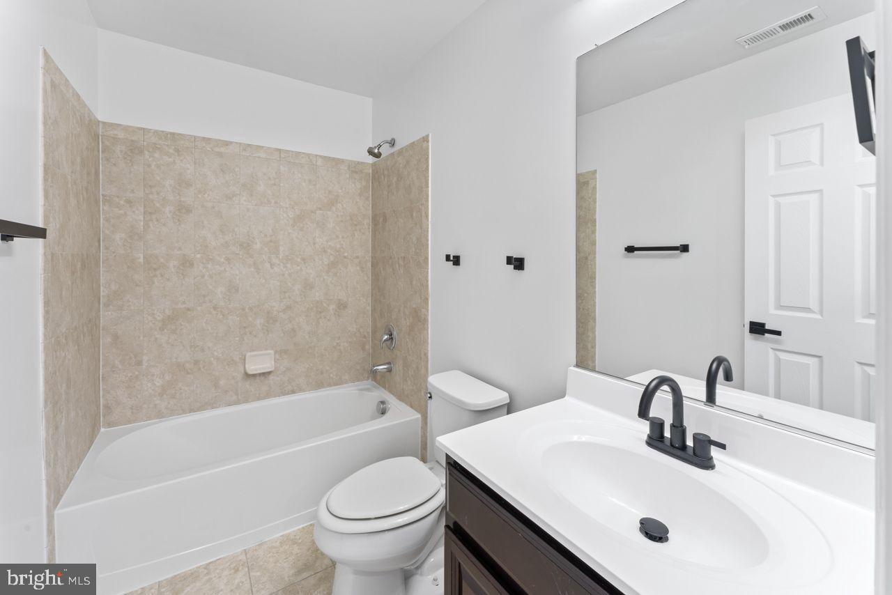 17045 Gibson Road Dumfries, VA 22026 - Photo 9 of 32 Modern bathroom with elegant finishes.