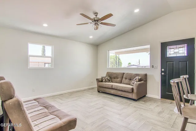 a living room with furniture and a window