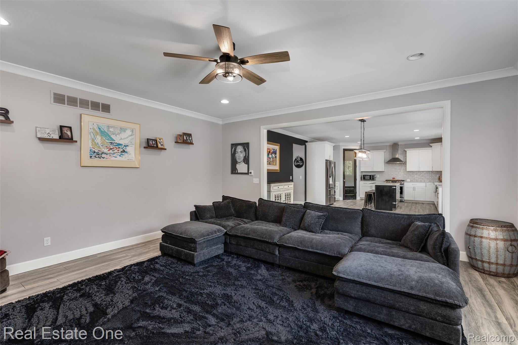 2983 28 Mile Road Washington, MI 48094 - Photo 17 of 54 Living area featuring wood-finish flooring, recessed lighting, and a ceiling fan