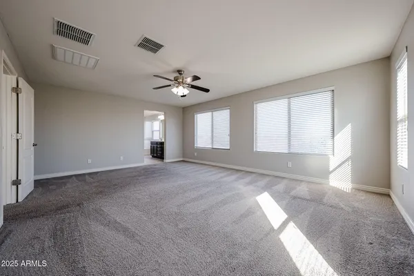 a view of an empty room with a window