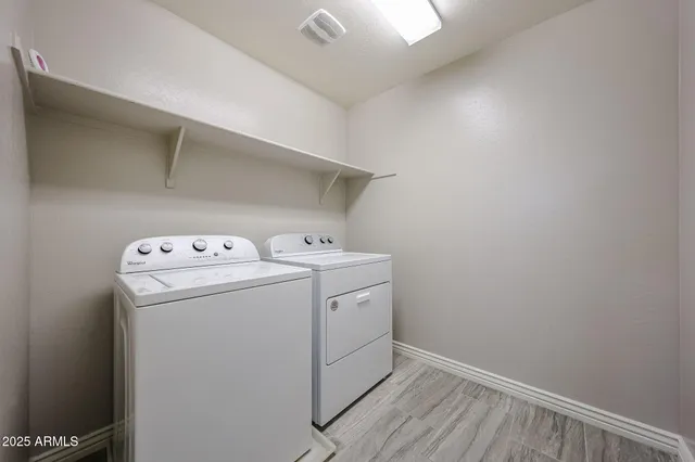 a utility room with dryer and washer